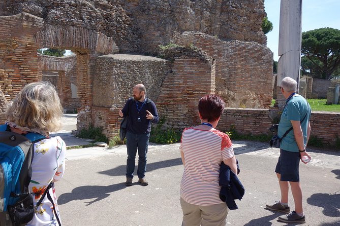 Ancient Ostia Antica Semi-Private Day Trip from Rome by Train with Guide - The Baths of Neptune and Roman public life