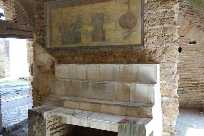 Ancient Ostia Antica Semi-Private Day Trip from Rome by Train with Guide - Shops, apartments, and the details of ordinary life
