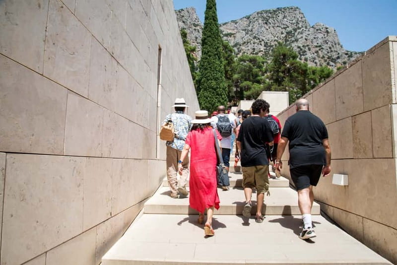 Athens: Delphi and Arachova Day Trip with Guide - Entering Delphi’s sanctuary on Mount Parnassus