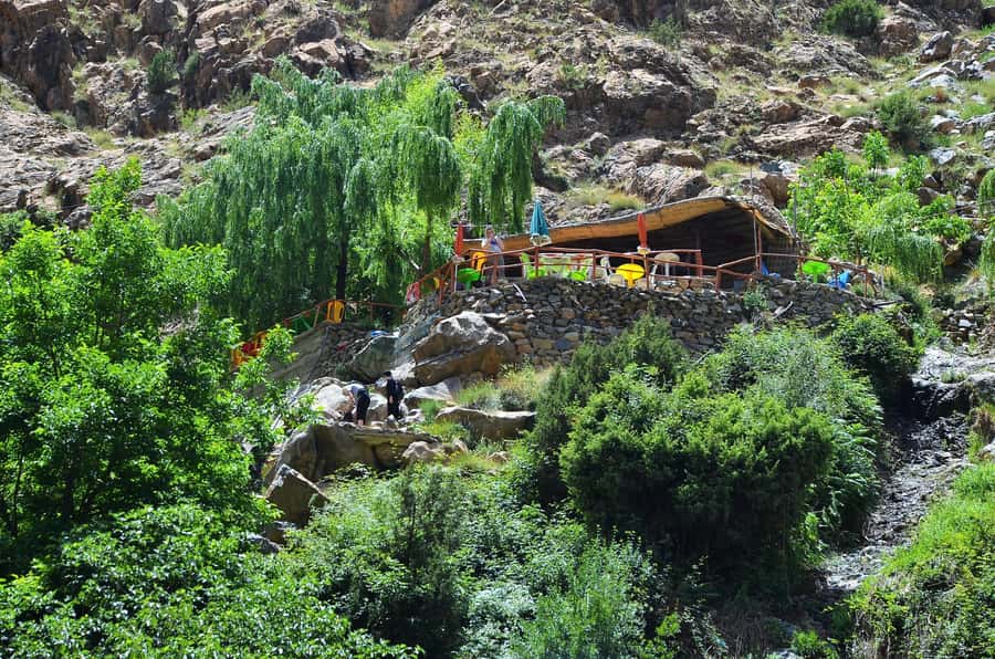 Day Trip To Ouzoud Waterfalls & Boat Ride From Marrakech - The wooden boat ride close to the spray