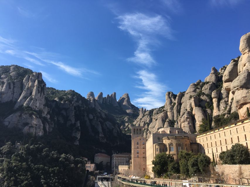 From Barcelona: Montserrat Full-Day Trip with Guided Hike - Riding the St. Joan funicular into the mountains