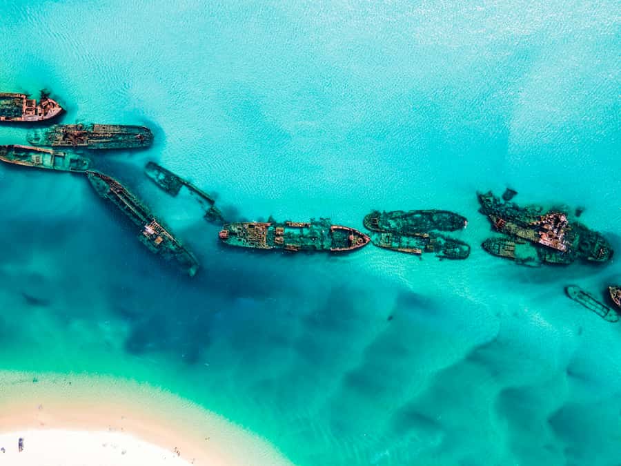 From Brisbane: Moreton Island Full-Day Trip - Transparent kayaks over clear water
