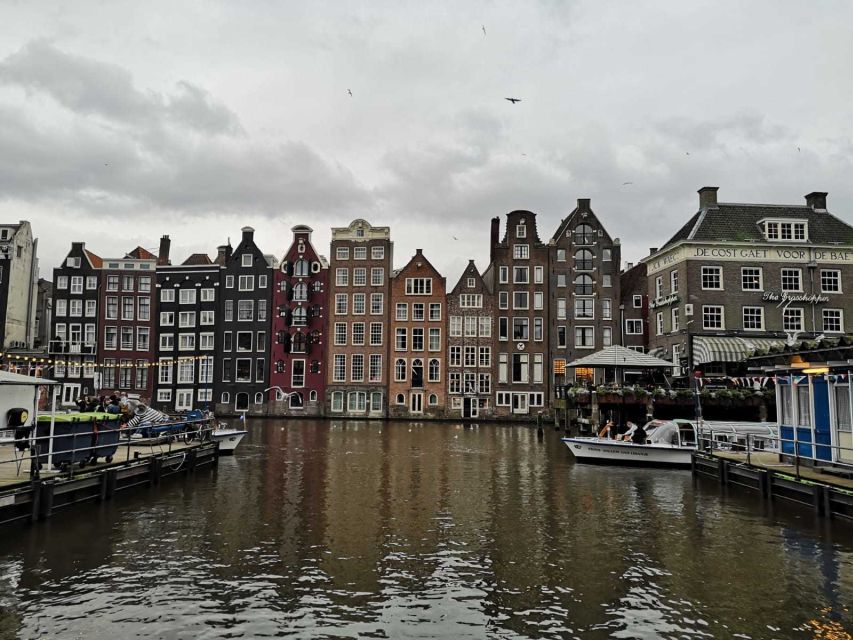 From Brussels: Day Trip to Amsterdam with Canal Boat Cruise - Amsterdam arrival, city stories, and first landmarks
