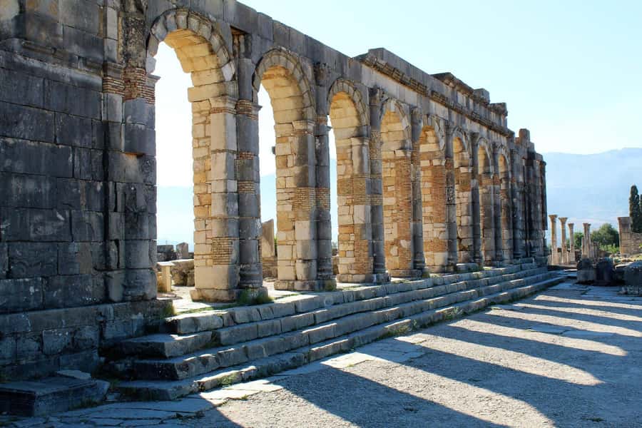 From Fez: Volubilis Moulay Idriss and Meknes Day Trip - Walking among the Roman ruins at Volubilis
