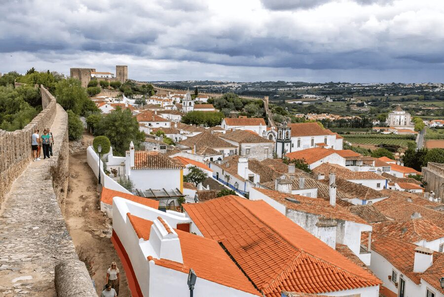 From Lisbon: Nazare Big Waves and Óbidos Guide Day Trip - Two very different sides of Portugal in one day