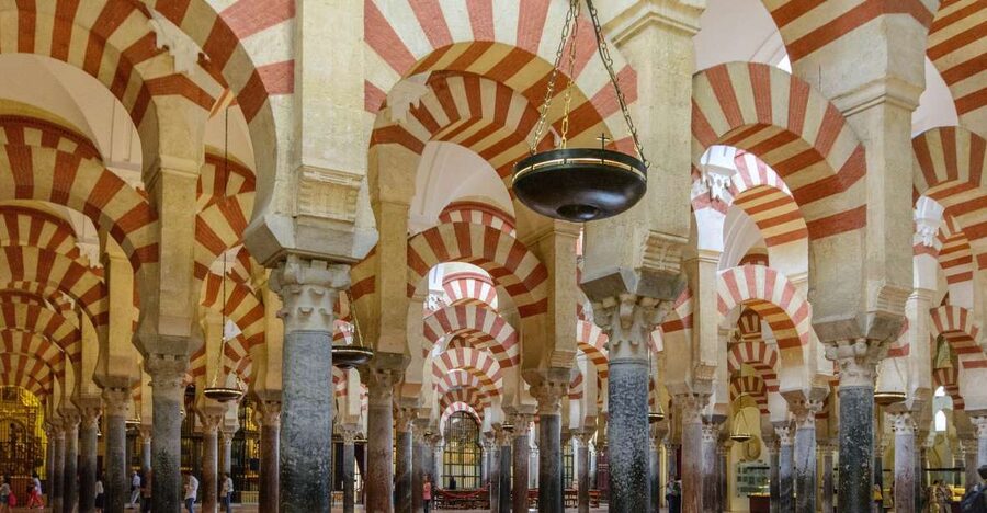 From Malaga: Cordoba Day Trip and Mosque-Cathedral - Crossing the Roman Bridge