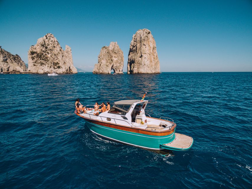 From Naples: Capri Boat Day Trip with Drinks - Swimming and snorkeling in clear coastal water