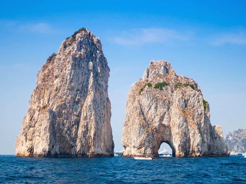 From Naples: Capri Day Trip with Ferry and Island Boat Tour - The 55-minute ferry ride along the Sorrento coast