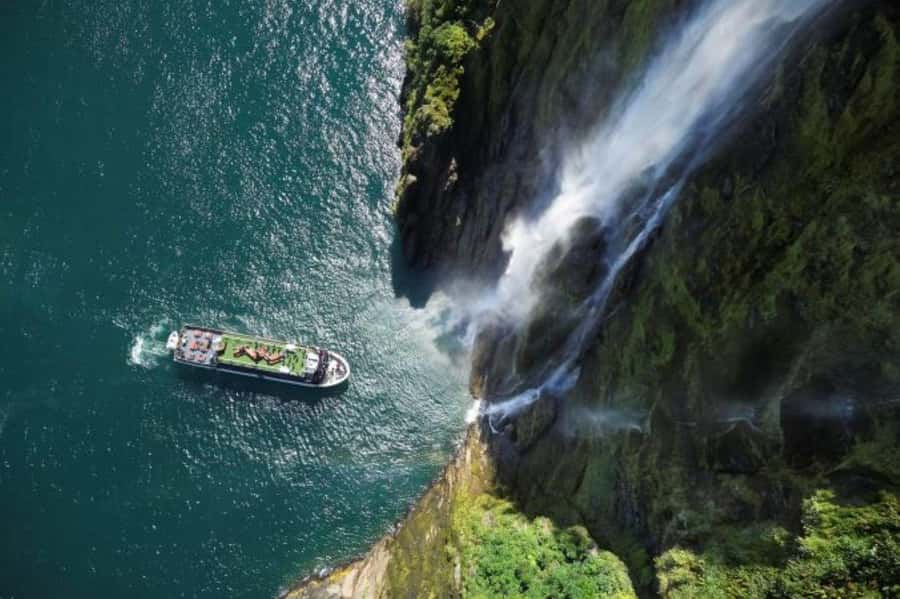 From Te Anau: Milford Sound Cruise and Coach Day Trip - Milford Sound by boat, with cliffs close overhead