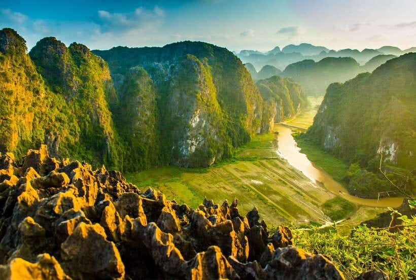 Hoa Lu, Tam Coc, & Mua Cave Day Trip with Lunch & Limousine - Tam Coc by boat, through rice fields and limestone cliffs