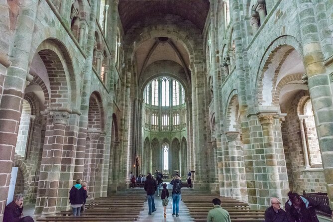 Mont Saint Michel Day Trip from Paris with English Speaking Guide - Entering the abbey with the audio app