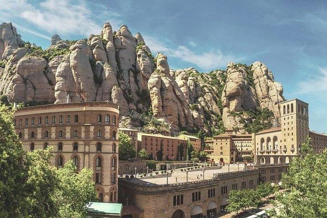Montserrat Day Trip Private or Small Group with Basilica Tickets - Catalan cheeses, ham, and the Montserrat market