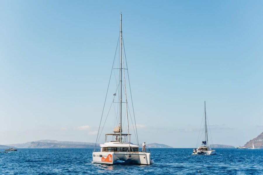 Santorini: Luxury Catamaran Day Trip with Meal and Open Bar - Setting out from Santorini’s port