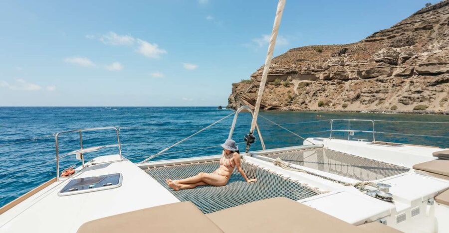 Santorini: Luxury Catamaran Day Trip with Meal and Open Bar - The hot springs are warm, not hot