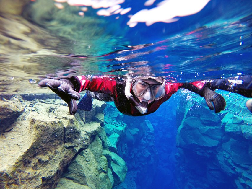 Silfra: Half-Day Snorkeling Day Trip with Underwater Photos - Getting into a drysuit at Silfra