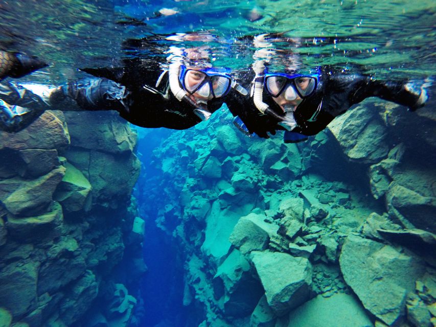 Silfra: Half-Day Snorkeling Day Trip with Underwater Photos - The first moments in the cold water