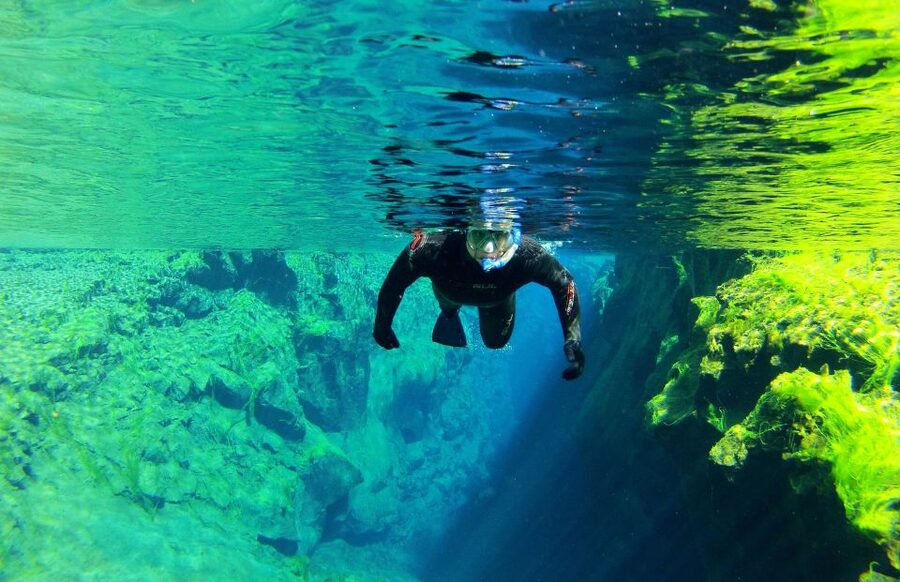 Silfra: Half-Day Snorkeling Day Trip with Underwater Photos - Floating through the blue rift