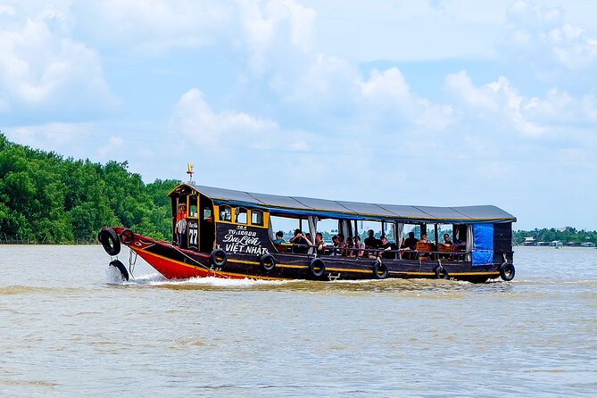 Small-Group Mekong Delta Day Trip: Boat Ride, Cottages & Pagoda - The hand-rowed boat through the canals