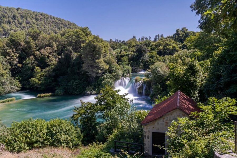 Split: Krka Waterfalls Guided Day Trip with Swim & Boat Tour - Walking through Krka National Park